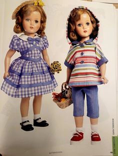 an open book with two dolls on the front and back cover, one holding a basket