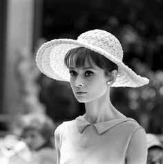 black and white photograph of a woman wearing a hat