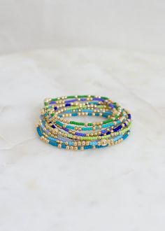 "❖Olivia Bracelet❖ * Your new favorite bracelet! Delicate and minimalistic, perfect for stacking! ‣ This listing is for a single bracelet. ‣ Buy more, save more - applied at checkout      * 3 10% off      * 5, 15% off      * 7, 20% off ‣ Olivia bracelet features: * 2mm Seed Beads * 3mm 14k Gold Filled Beads in random order * 1-5m 14k Gold Filled Bead Julisa Bracelets Feature:  ‣ Tight/Sturdy elastic, pre-stretched to prevent bracelet from stretching out ‣ Sizing according to wrist size ‣Sizing T Blue Stretch Bracelet With Tiny Beads, Minimalist Green Beaded Bracelets With Tiny Beads, Minimalist Green Beaded Bracelet With Tiny Beads, Olivia Bracelet, Teal Bracelet, Single Bracelet, Star Bracelet, Cute Bracelets, Beaded Stretch Bracelet