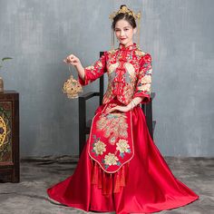 Looking a traditional Chinese bridal gown. This beautiful 2-piece qun kwa set is embroidered with gold, silver,blue and white threads. The intricate flower and peacock embroideries are decorated throughout the jacket and skirt. The peacock is a manifestation of the heavenly phoenix on earth, divinity, beauty, power, rank, and beauty. It's a perfect option for your traditional Chinese wedding, tea ceremony. Size Guide: Please refer to the size guide picture before placing the order. Please leave Traditional Embroidered Wedding Dress, Traditional Drape Dress With Gold Embroidery For Ceremonies, Fitted Embroidered Dress With Traditional Patterns For Wedding, Traditional Embroidered Dress For Wedding With Traditional Patterns, Traditional Embroidered Dress With Traditional Patterns For Wedding, Festive Gown With Gold Embroidery For Traditional Ceremonies, Traditional Embroidered Dress With Patterns For Wedding, Gold Embroidered Dresses For Traditional Ceremonies And Festivals, Traditional Floor-length Embroidered Dress For Ceremonies