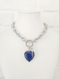 Thick Texturized Chain Stainless Steel Necklace with Lapis Lazuli Heart Pendant This stunning chunky charm necklace is the perfect statement piece. This necklace exudes elegance and style and features a large, beautifully crafted Lapis Lazuli heart pendant. The thick, texturized stainless steel chain adds a modern touch, ensuring durability and a sleek finish. Key Features: Material: High-quality stainless steel chain Pendant: Large Lapis Lazuli heart Design: Chunky, texturized chain with a big Chunky Chain Pendant Jewelry Gift, Metal Charm Necklaces With Chunky Chain For Gifts, Metal Charm Necklace With Chunky Chain For Gift, Gift Chunky Chain Necklace With Round Pendant, Sterling Silver Pendant With Chunky Chain, Chunky Chain Heart Pendant Necklace As Gift, Chunky Chain Heart Pendant Necklace For Gift, Chunky Chain Jewelry For Valentine's Day Gift, Valentine's Day Gift Chunky Chain Jewelry