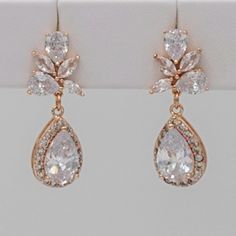 Rose gold-plated dangle earrings with CZ accents. Carefully handmade with quality components. Earrings measure approx. 1-5/16 inches long. Traditional Earrings, Silver Jewelry Fashion, Wedding Jewelry Earrings, Etsy Earrings Dangle, Exquisite Jewelry, Wedding Earrings, Rose Gold Plates, Wedding Jewelry, Silver Jewelry