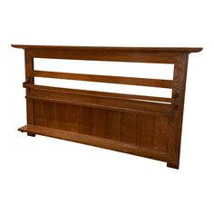 a wooden headboard with two shelves on each side