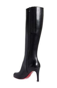 New to the maison's lineup of sleek, sophisticated footwear comes this timeless knee-high boot whose rounded toe balances the stiletto heel. Christian Louboutin's iconic red sole—born from a fateful brush with red nail lacquer—lends distinctive brilliance to every step. 3 1/2" (85mm) heel (size 38.5) 16" shaft; 14 1/4" calf circumference Side zip closure Wipe with a soft, dry cloth and store in a dust bag Please note the red lacquer on soles will wear off as a result of normal use. To minimize the effect, avoid wearing in wet weather or on abrasive surfaces Leather upper, lining and sole Made in Italy Designer Shoes Louboutin Boots, Christian Louboutin Boots, Leather Western Boots, Red Nail, Red Lacquer, Red Sole, Wet Weather, Pretty Shoes, Hair Tips