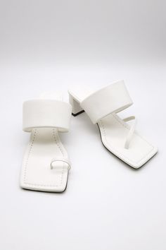 Toe Thong Mid Heeled Sandals This product has been hand-picked by Storets' stylists. Keep in mind that you would have to check on every item's details and check whether the shoes run small to size or regularly by footwear size chart. The manufacturer size is irrelevant to the actual sales size, and the sales standard size is US! Summer White T-strap Sandals With Heel Loop, White T-strap Sandals With Heel Loop For Summer, Adjustable White Sandals With Heel Loop, Trendy White Toe Post Sandals, White Toe Post Sandals For Summer, White Toe Post Ring Sandals For Summer, White Toe Post Toe Ring Sandals For Summer, Trendy White Square Toe Sandals, Modern Toe Post Heels For Summer