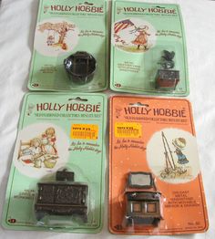 four small toy cars are on display in plastic packaging, including one for the hobbie