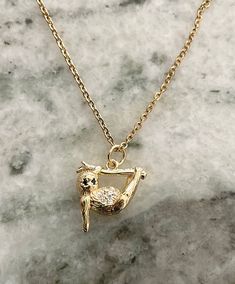 Sloth charm is 19.5x16x6mm Stainless Steel Gold Plated Chain. Gold Charm Necklace With Cubic Zirconia, Gold Cubic Zirconia Charm Necklace With Lobster Clasp, Nickel-free Gold Cubic Zirconia Jewelry, Gold Cubic Zirconia Nickel-free Jewelry, Nickel Free Gold Jewelry With Cubic Zirconia, Nickel-free Cubic Zirconia Pendant Jewelry, Nickel-free Cubic Zirconia Pendant Necklace, Nickel-free Gold-plated Charm Necklaces, Nickel-free Yellow Gold Dangle Necklace