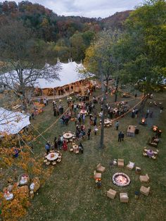 an aerial view of a party in the woods