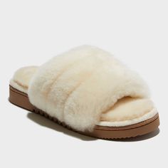 You won't want to take these off once you try them on; and honestly, we can't blame you. Featuring an over-the-top-soft combo of plush memory foam insoles and genuine shearling, your feet are sure to thank you when you slide on the Dluxe Betty One Band slippers. Naturally moisture wicking and with indoor/outdoor designs, they're a solid pick for relaxing on the go, too! Comfortable Faux Fur Slippers With Cushioned Footbed, Cozy Faux Fur Slippers With Cushioned Footbed, Indoor Faux Fur Slippers With Plush Lining, Indoor Slippers With Plush Lining And Faux Fur, Comfortable Fluffy Sheepskin Slippers, Fluffy Comfortable Sheepskin Slippers, Fluffy Sheepskin Comfortable Slippers, Shearling Slippers With Plush Lining, Outdoor Designs