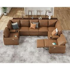 a living room filled with lots of brown furniture