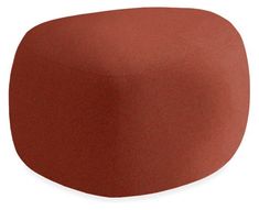 an orange ottoman that is sitting on top of a white surface and has a red cover over it