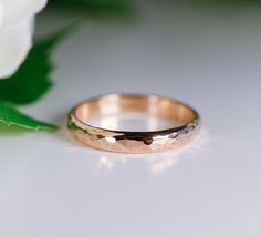 "This stackable 14k yellow gold hammered ring is perfect for wearing alone or mixing and matching with your other rings. It's perfect for as wedding band or promise ring. This band was hand crafted in Melt'm Jewelry Studio in California. DETAILS AND MATERIAL Band is 3 mm wide and 1.5 mm thickness and hammered. Please contact me for non hammered, satin or mirror finish. 14k solid yellow gold. RING SIZE : Please choose your size from drop down menu. Thank you! HANDMADE TO ORDER within 1 week after Anniversary Rose Gold Hammered Stackable Rings, Wedding Stackable Hammered Rose Gold Rings, Hammered Rose Gold Stackable Rings For Wedding, Wedding Hammered Rose Gold Stackable Rings, Classic Hammered Stackable Wedding Rings, Hammered 14k Gold Stackable Wedding Rings, 14k Gold Hammered Stackable Wedding Rings, Rose Gold Hammered Wedding Rings, Hammered 14k Gold Wedding Band