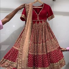 This Is A Brand New Never Been Worn Wedding Lehenga From Benzer In Mumbai. It Is Customized Measurement Size 42 In Length. Skirt Is Georgette Material With Beautiful Detailed Handwork. Blouse Is Raw Silk With Deep V Neck. Dupatta Is Beige Net. Also Have A Red Dupatta. Skirt Has Cancan And Blouse Is Padded. Room To Open Blouse If Needed. Would Fit 32-34 Bra Size. Traditional Drape Dresses With Dupatta For Marriage, Semi-stitched Resham Embroidery Sharara For Marriage, Elegant Choli For Marriage Festive Occasions, Resham Embroidery Semi-stitched Sharara For Wedding, Floor-length Traditional Wear With Dupatta For Marriage, Elegant Red Lehenga For Ceremony, Traditional Drape Gown With Intricate Embroidery For Marriage, Elegant Sharara For Marriage And Festive Occasions, Elegant Festive Sharara For Marriage