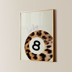 an animal print with the number eight in it's center is mounted on a wall