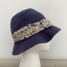 Nautica Girl’s Denim Bucket Hat - Blue Floral- One Size- suggesting fitting 6-9T. Garment manufacturer label removed. Dry-cleaned. In very good preloved condition. Navy Cotton Brimmed Hat, Blue Cotton Wide Brim Hat, Denim Blue Cotton Hat For Beach, Spring Denim Bucket Hat With Short Brim, Navy Bucket Hat With Curved Brim For Summer, Blue Cotton Bucket Hat With Flat Brim, Denim Blue Hat With Curved Brim, Summer Washed Blue Denim Hat, One Size Fits Most Denim Blue Cotton Hat