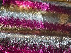 the sequins are all different colors and patterns on the fabric, but they look like glitter