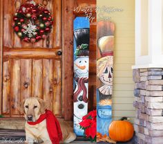 a dog sitting in front of a door with decorations on the outside and behind it