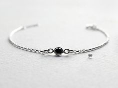 "Ultra skinny bar & sparkling bezel-set CZ stone bracelet set. Handcrafted in sterling silver, they are simple and minimal, delicate yet sturdy. A beautiful and versatile bracelet set - Layer together or wear individually for two totally different looks. Available in clear CZ or Black CZ. Listing is for two bracelets. Made to Order. DETAILS Silver Skinny Bar: 32mm ( 1.25-inch) Length CZ Stone: 4mm * This bracelet set is made of high quality Sterling Silver materials. * Top-quality Cubic Zirc Silver Bar, Dainty Bracelets, Layered Bracelets, Silver Bars, Cz Diamond, Ankle Bracelets, Tape Measure, Cz Stone, Stone Bracelet