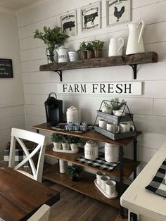 a farm fresh sign is hanging on the wall above a table with two white chairs