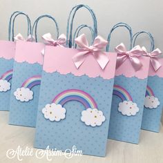 four bags with rainbows and clouds on them