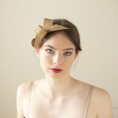 The gold fascinator in minimalist loops shape is perfect for wedding guests, bridesmaids, or even the mother of the bride or groom. It adds a formal, sophisticated touch and pairs beautifully with dresses in solid colors or subtle patterns. The metallic sheen of gold can complement both light and dark outfits, making it a versatile choice for wedding attire. The fascinator is made of premium millinery sinamay, it is a lightweight material known for its durability, making it the perfect choice fo Chic Fascinator Headband For Events, Chic Headband Fascinator For Events, Adjustable Chic Fascinator Headband, Chic Adjustable Fascinator On Headband, Chic Adjustable Headband Fascinator, Elegant Summer Event Hair Accessories, Chic Summer Evening Hair Accessories, Elegant Fascinator With Pinched Crown For Gift, Elegant Pinched Crown Fascinator Gift