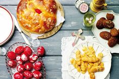 various desserts and pastries are on the table