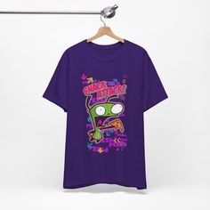 Unisex Scene Fashion Shirt - Invader Zim Vintage Tshirt - 2000'S Emo Hot Topic Style This classic unisex jersey short sleeve tee fits like a well-loved favorite. Soft cotton and quality print make users fall in love with it over and over again. These t-shirts have-ribbed knit collars to bolster shaping. The shoulders are tapered for a better fit over time. Dual side seams hold the garment's shape for longer.  .: Made with 100% Airlume combed and ring-spun cotton, a lightweight fabric (4.2 oz/yd² (142 g/m that is easy to layer, breathable. Perfect for active and leisure wear.  .: The retail fit that is perfect for casual and semi-formal settings. The crew neckline adds a classic, neat style that's perfect for accessorizing. .: Bella+Canvas manufactures all its products in the US and interna Retro Purple T-shirt With Graphic Print, Purple Crew Neck T-shirt With Front Print, 90s Cotton T-shirt With Front Print, Casual Purple T-shirt For Fan Merchandise, Retro Short Sleeve Fan Merchandise Shirt, Retro Short Sleeve Tops With Sublimation Print, Vintage Short Sleeve Shirt With Sublimation Print, Retro Relaxed Fit T-shirt With Sublimation Print, Pop Culture Screen Print Short Sleeve Tops