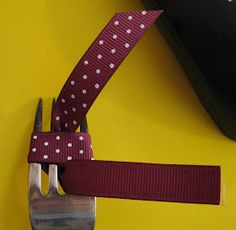 a knife and fork on a yellow surface