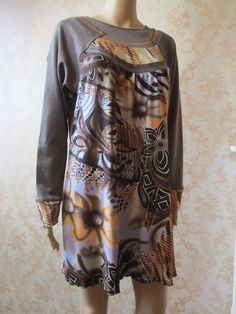 Plus size dress in brown with an abstract pattern in blue\yellow\brown.  It has a high round neck and long sleeves,  the material is quite thick so ideal for autumn\winter. Bust, pit to pit;  20" Inside sleeve;  23" Length;  31" Made by  S'QUISES 65% polyester  30% viscose  5% elastin Brown Long Sleeve Patchwork Dresses, Retro Brown Dress For Fall, Patterned Long Sleeve Dresses For Fall, Patterned Long Sleeve Fall Dresses, Brown Long Sleeve Dress For Fall, Retro Beige Long Sleeve Dress, Fitted Long Sleeve Brown Dress For Fall, Fitted Brown Long Sleeve Dress For Fall, Vintage Autumn