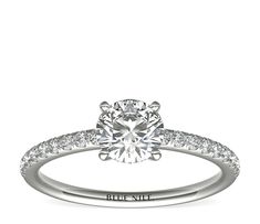 a white gold engagement ring with diamonds on it