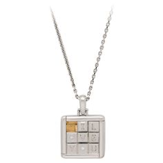 A rare 18ct white gold and diamond puzzle pendant by Cartier 1997, the pendant of square shape formed as a sliding puzzle with eight movable tiles which spell out the phrase ‘I LOVE YOU’, each letter O formed of a small round brilliant cut diamond, with an oval bale and suspended from an 18” chain. 150 of these pendants were made to celebrate Cartier’s 150 year anniversary in 1997, this pendant is number 62 of that limited edition and is engraved to the reverse with the initials L and C with a h Cartier Diamond Necklace For Gift, Cartier Hallmarked Necklace For Anniversary, Cartier Clash Necklace, Cartier 1895 Earrings, Cartier 1895 Necklace, Sliding Puzzle, Cartier Diamond, Gold Sign, Shape And Form