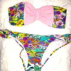 Size L/Xl Multicolor Swimsuit With Beautiful Design A Pastel Pink Bow In The Front Of The Top The Top Does Have Padding They Are Removable New With Tags The Swimsuit Does Come With Removable Straps Playful Pink Swimwear For Beach Party, Playful Pink Swimwear For Sunbathing, Playful Pink Printed Swimwear, Fun Pink Swimwear For Beach, Pink Playful Stretch Swimwear, Playful Pink Stretch Swimwear, Pink Fun Swimwear For Beach Party, Pink Printed Swimwear For Beach Season, Pink Printed Swimwear For Beach Party