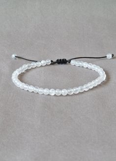 Delicate dainty selenite gemstone bracelet. Stress relief wellness healing crystal selenite - slim style beaded bracelet - natural selenite crystal - boho chic style made with black string and adjustable closure - ready to give it as a gift this dainty bracelet comes wrapped in one nice jewelry bag.  If you like this bracelet please leave a score and a few words why you like it on the review section. Thank you very much! About order: Please measure your wrist accurately then select your size fro Nice Jewelry, Boho Chic Style, Slim Style, Selenite Crystal, Dainty Bracelet, Gift For Woman, Jewelry Bag, Dainty Bracelets, Nature Bracelets