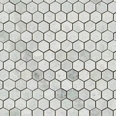 a white tiled floor with hexagonal tiles in the shape of hexagons