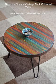 a multicolored coffee table with a bowl on it