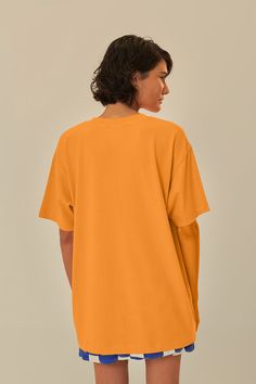 Embrace the vibrant spirit of Brazil with the Orange Farm Rio To Table Organic Cotton T-Shirt. This sun-kissed orange tee features a round neckline and a relaxed fit, perfect for casual days out. Adorned with a playful, tropical illustration that captures the essence of Brazilian flora and fauna, it's a piece that brings joy and color to any outfit. Made with organic cotton, it's not only stylish but also gentle on the planet. Composition 100% COTTONCare Instructions MACHINE WASH, GENTLE CYCLE, DO NOT BLEACH, DO NOT TUMBLE DRY, LINE DRYING, IRON AT MEDIUM HEAT, DRY CLEAN WITH ANY SOLVENT EXCEPT TRICHLOROETHYLENESize and Fit Inches XXS XS S M L XL Bust 40 2/4 42 2/4 44 2/4 46 2/4 49 2/4 52 2/4 Waist 40 3/4 42 3/4 45 46 3/4 49 3/4 52 3/4 Length 28 28 2/4 29 1/4 29 2/4 30 3/4 31 2/4 Hip 43 3/ Orange Relaxed Fit Tops For Streetwear, Basic Orange Crew Neck T-shirt, Orange Crew Neck Top With Graphic Print, Oversized Orange Casual Tops, Oversized Orange Crew Neck Top, Oversized Orange T-shirt For Streetwear, Oversized Orange Tops For Streetwear, Orange Graphic Print Top With Relaxed Fit, Oversized Orange Summer T-shirt