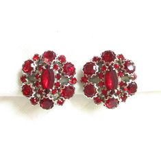 Deep Rich Red Rhinestone and Silver Decorative Prong Mount Vintage Clip Back Earrings - NY Estate Jewely Vintage Red Clip-on Earrings, Vintage Red Clip-on Earrings For Anniversary, Vintage Red Clip-on Earrings For Evening, Red Vintage Clip-on Earrings, Red Vintage Clip-on Earrings For Anniversary, Retro Red Clip-on Earrings For Formal Occasions, Vintage Red Earrings, Designer Vintage, Vintage Clip