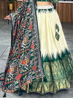 Elevate your ethnic wear collection with this beautiful off-white & green patola printed silk traditional lehenga choli. Crafted from high-quality dola silk material, this stunning ensemble features intricate patola and paithni printed work along with foil work (crush work) that adds a touch of elegance and sophistication. The off-white lehenga is paired with a green color dola silk choli and a matching dupatta, making it a perfect choice for weddings, festivals, or any special occasion.
Thi Work Crush, Traditional Lehenga, White Lehenga, India Country, Silk Lehenga, Silk Dupatta, Lace Border, Silk Material, Printed Silk