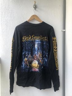 an iron maiden long sleeve shirt hanging on a wall