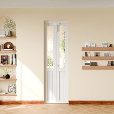 an empty room with bookshelves and shelves on the wall next to a door