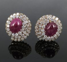 Vintage 9.0ct Diamond & 17.0ct Cabochon Cut Ruby 18K Yellow Gold Clip Earrings   Up for sale is a pair of diamond & cabochon cut ruby clip earrings. These gorgeous earrings are made of 18K yellow gold. These clip earrings feature large size rubies with diamonds around them in a spiraling design. The diamonds are large size and the rubies show an intense red color The diamonds weigh approximately 9.0 carats; they are G to H color and VS to SI clarity. The cabochon cut rubies weigh approximately 17.0 carats; they have strong red color and semi translucent clarity. This vintage pair has rich patina and light wear on the gold. Each earring measures 27 x 25mm (1.06 x 0.98 inch). The weight of these earrings is 22.8 grams.   Terms Shipping Payment is expected to be made within 7 days. Paypal pay Jewellery Styling, Jewellery South Indian, Real Diamond Earrings, Ancient Jewels, 3 Earrings, Gold Bridal Jewellery, David Webb, South Indian Jewellery, Jeweled Earrings