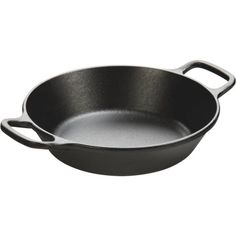 an empty frying pan on a white background