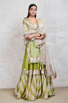 Green kurta with Parsi embroidered floral motifs and mirror work. Comes with sharara and dupatta.
Components:3
Pattern:Embroidery
Type of Work:Resham, Sequin, Zari, Mirror and Gota
Neckline:Scoop
Sleeve Length:Full
Fabric:Georgette
Color:Green
Other Details:
Dupatta with tassels
Side slits
Occasion:Wedding - Aza Fashions Pista Green Sharara With Intricate Embroidery In Raw Silk, Pista Green Raw Silk Anarkali Set With Intricate Embroidery, Festive Pista Green Palazzo Set With Intricate Embroidery, Festive Pista Green Embroidered Palazzo Set, Unstitched Pista Green Sharara With Intricate Embroidery, Green Sharara With Intricate Embroidery In Tissue Silk, Embroidered Pista Green Palazzo Set For Wedding, Transitional Sharara With Intricate Embroidery In Chanderi, Pista Green Intricate Embroidery Chanderi Palazzo Set