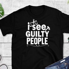 Fun black and white  t shirt for lawyers and any one in the legal profession. The shirt is for those who want to see the humor in their profession. Great gift for lawyers, judges, and any law maker. Fun graduation gift for a new lawyer. Funny Black Ring-spun Cotton Tops, Funny Black T-shirt, Funny Black Shirt For Streetwear, Black T-shirt With Text Print, Lawyer Vibes, Funny Text T-shirt In Ring-spun Cotton For Streetwear, Black Crew Neck T-shirt With Funny Text, Law School Shirt, Black Pre-shrunk Ring-spun Cotton Shirt