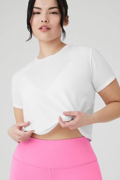 The Cropped All Day Short Sleeve is the ultimate everyday, throw-on-and-go crew neck tee. It’s made from super-soft, lightweight modal jersey fabric and hits right at the waist — perfect for creating effortless and endless outfits with any Alo bottom. Wear it solo or layered under a light cover up and get going. Super-soft modal jersey fabric Pairs perfectly with go-to high-waist bottoms Designed & uniquely fit to flatter every size Wear-tested by our in-house team for the perfect fit Sporty Scoop Neck T-shirt For Everyday, Compressive Solid Color Crew Neck T-shirt, Compressive Crew Neck T-shirt, Seamless Short Sleeve T-shirt For Athleisure, Solid Compressive Crew Neck T-shirt, Versatile T-shirt With Shirttail Hem For Layering, White Stretch Alo Yoga Top, Alo Yoga Stretch Tops For Loungewear, Versatile Moisture-wicking Crew Neck T-shirt