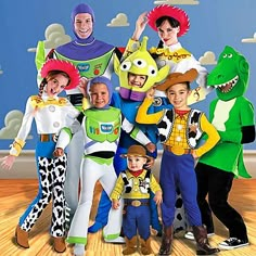 a group of people in costumes standing next to each other