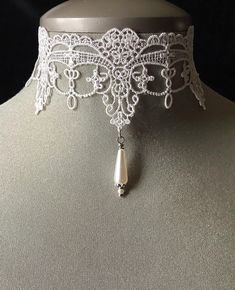 Lace pearl choker! A very intricate, white lace choker! I have aded a beautiful teardrop pearl to the middle of the choker.... The perfect accessory for the "Victorian" and Vintage" bride! To the back I have also added a 4" extension chain...please message me if you would like this choker a little shorter or a little longer...I can also add to the extension chain.... This elegant choker can also be worn as a "Graduation" accessory with that perfect dress.... Please select if you would like this item gift wrapped....I will also include a quality card with your special message.... Thank you for taking time to browse my shop "Veronica Rose Designs" Pearl Choker Wedding, Choker Pearl Necklace, White Lace Choker, Pearls And Lace, Fancy Collar, Choker Pearl, Victorian Accessories, Elegant Choker, Choker Necklace Designs