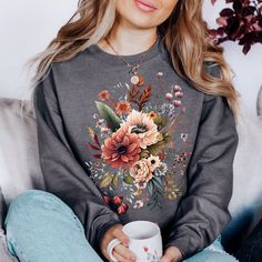 "You will love this floral sweatshirt! It has a cute, minimalist design and is sure to give you all the warm fuzzy feelings while wearing it. These crewnecks are really soft and super comfortable for lounging around at home or for wearing out and about. These cozy crewnecks make great birthday gifts for your best friend or anyone else :) *PRODUCT DESCRIPTION* -Gildan 18000 Unisex Crewneck Sweatshirt -50% cotton, 50% polyester -Medium-heavy fabric -Sewn-in label -Shirt colour may vary slightly du Fall Casual Sweatshirt With Plant Print, Flower Shaped Relaxed Fit Sweatshirt For Fall, Relaxed Fit Flower Sweatshirt For Fall, Casual Plants Print Sweatshirt For Fall, Cotton Floral Print Sweatshirt For Fall, Floral Print Spring Sweatshirt, Casual Fall Floral Tops, Fall Floral Print T-shirt, Gifts For Your Best Friend