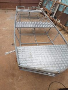 a metal bed frame sitting on the ground