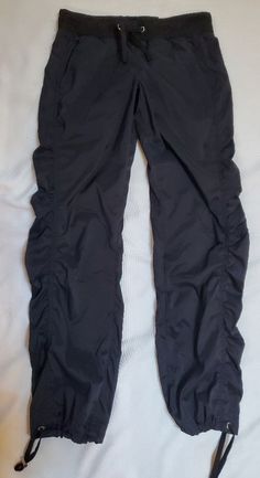 Drawstring Waist And Ankle Bnwt. Dry Wick Black Nylon Drawstring Bottoms, Black Nylon Bottoms With Drawstring, Black Stretch Parachute Pants With Drawstring, Fitted Black Bottoms With Drawstring, Fitted Black Nylon Pants, Fitted Sports Bottoms With Drawstring, Fitted Nylon Bottoms With Drawstring, Fitted Sports Pants With Drawstring, Black Nylon Bottoms With Elastic Side Panels